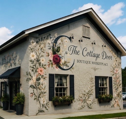 Concept rendering of the storefront painted with climbing flowers and the Cottage Door name
